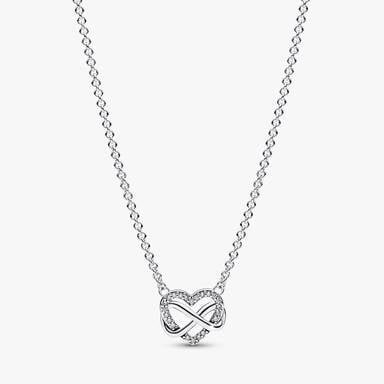 Ensemble de colliers et boucles d'oreilles scintillants avec cœur et symbole d’infini