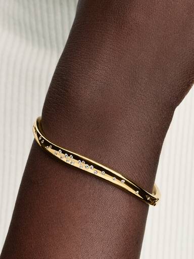 Bracelet rigide de forme organique avec pierres